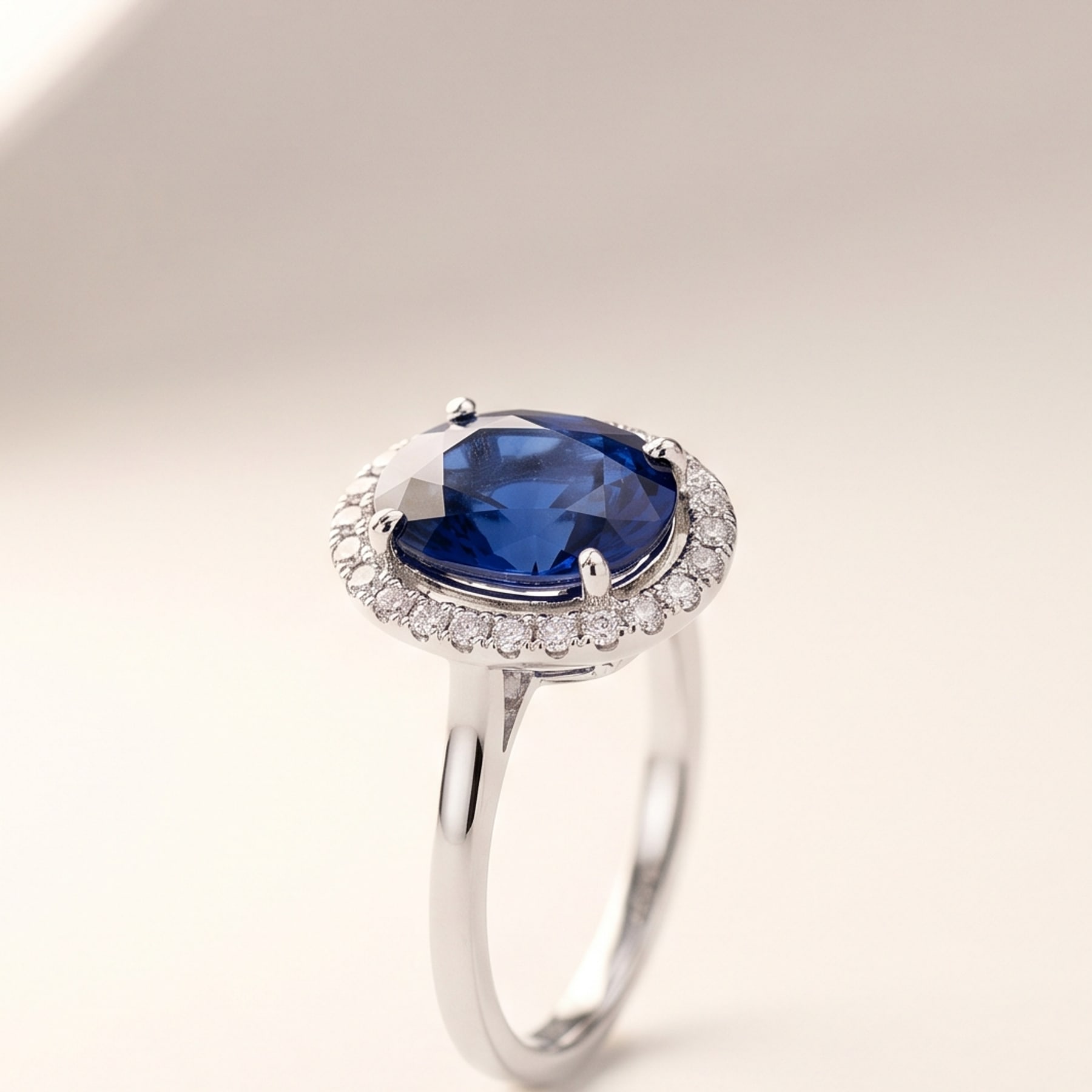 Sapphire Halo Ring, in 18k White Gold with a Blue Sapphire